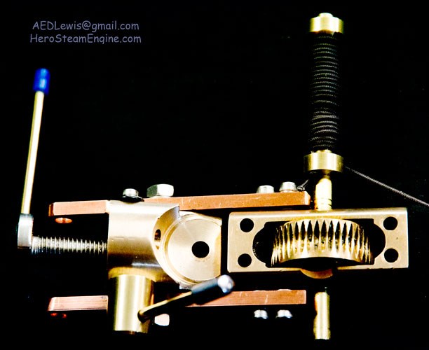 Photo of the crane lifting a bottle of water powered by the Hero engine as the operator adjusts the pivots. Pressure Gauge reads 8 psi.
                        